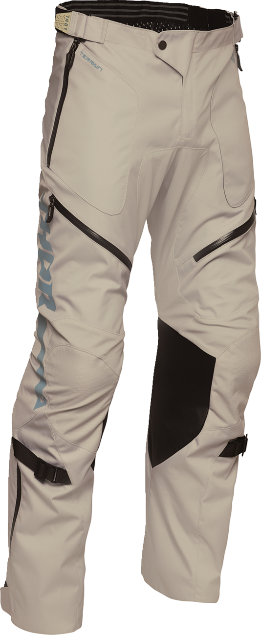 THOR Terrain over-the-boot pants in sand color, US 38 size, showing durable fabric and relaxed fit for outdoor riding.