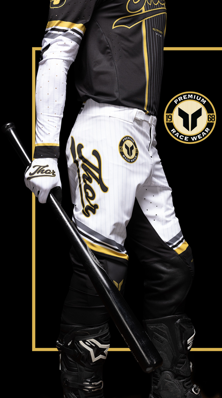 Black and gold THOR Sportmode Baller Pants with US 32 size, featuring sporty design and logo details.
