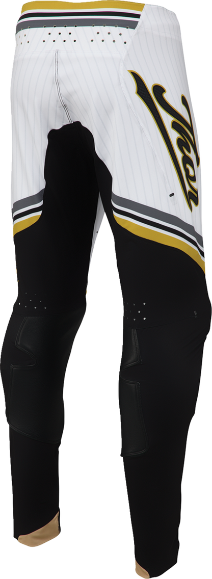 Black and gold THOR Sportmode Baller Pants, US 32, featuring sleek design and sporty style suitable for active wear.