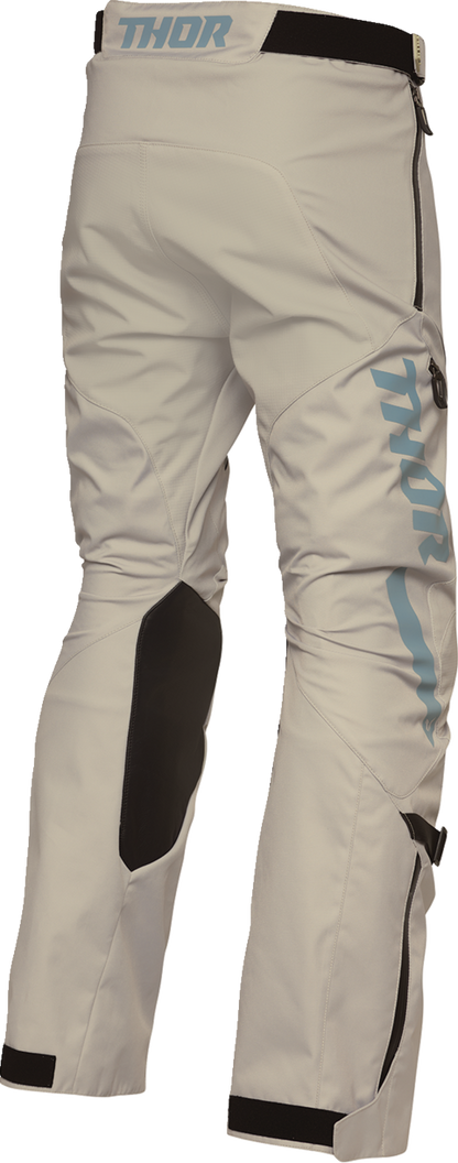 THOR Terrain over-the-boot pants in sand color, US size 36, featuring durable fabric and reinforced knees.