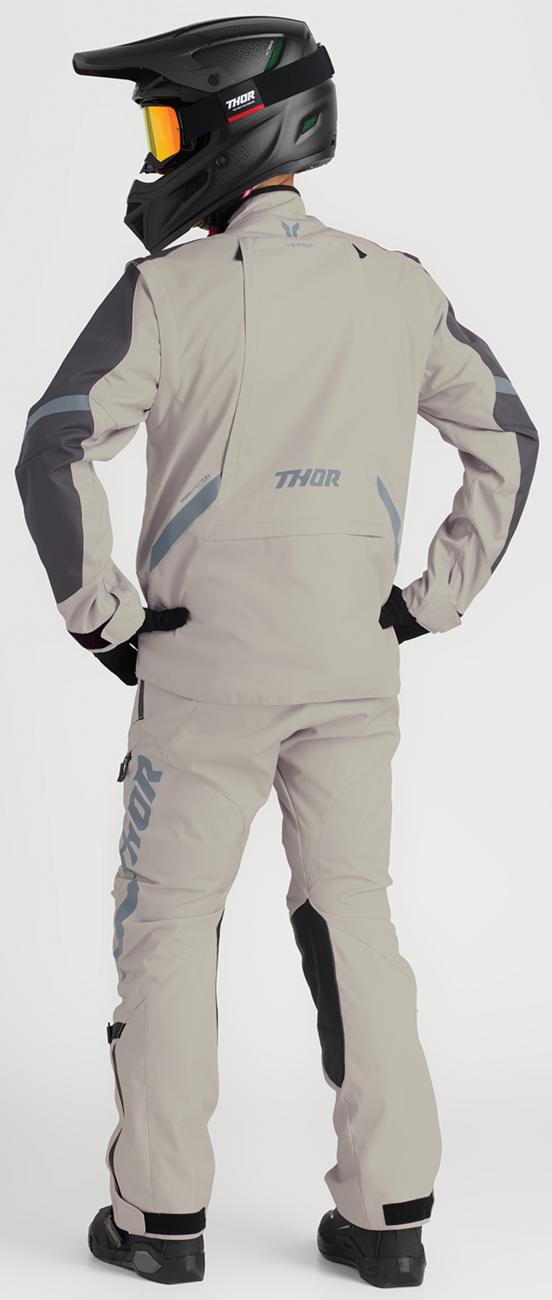 THOR Terrain over-the-boot pants in sand color, US size 28, featuring durable motorcycle riding gear with reinforced fabric.