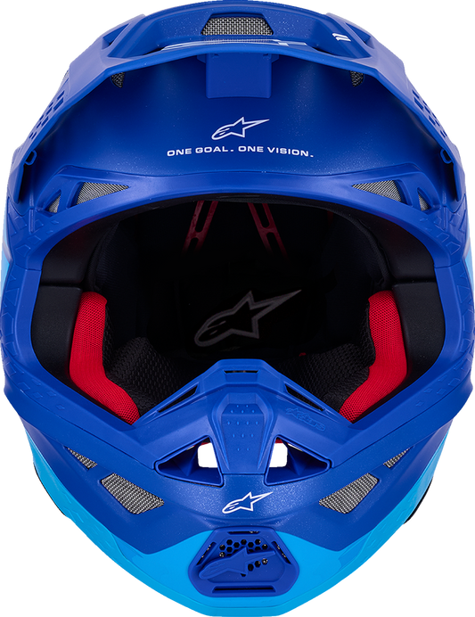 Alpinestars Supertech M10 helmet in flood blue and black with carbon finish and MIPS® technology, shown from a side angle.