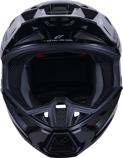 Alpinestars SM7 motorcycle helmet in solid gloss black, large size, featuring a sleek aerodynamic design and safety vents.