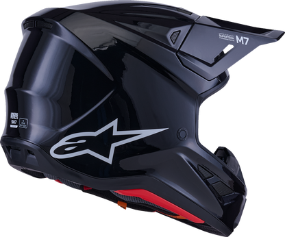 Alpinestars SM7 helmet in solid gloss black, large size, featuring a sleek aerodynamic design and secure chin strap.