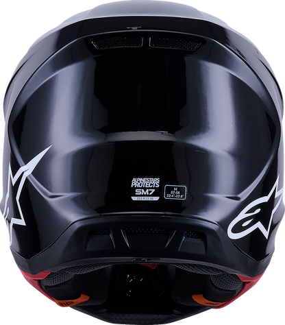Alpinestars SM7 helmet in solid gloss black, large size, with aerodynamic design and secure chin strap.