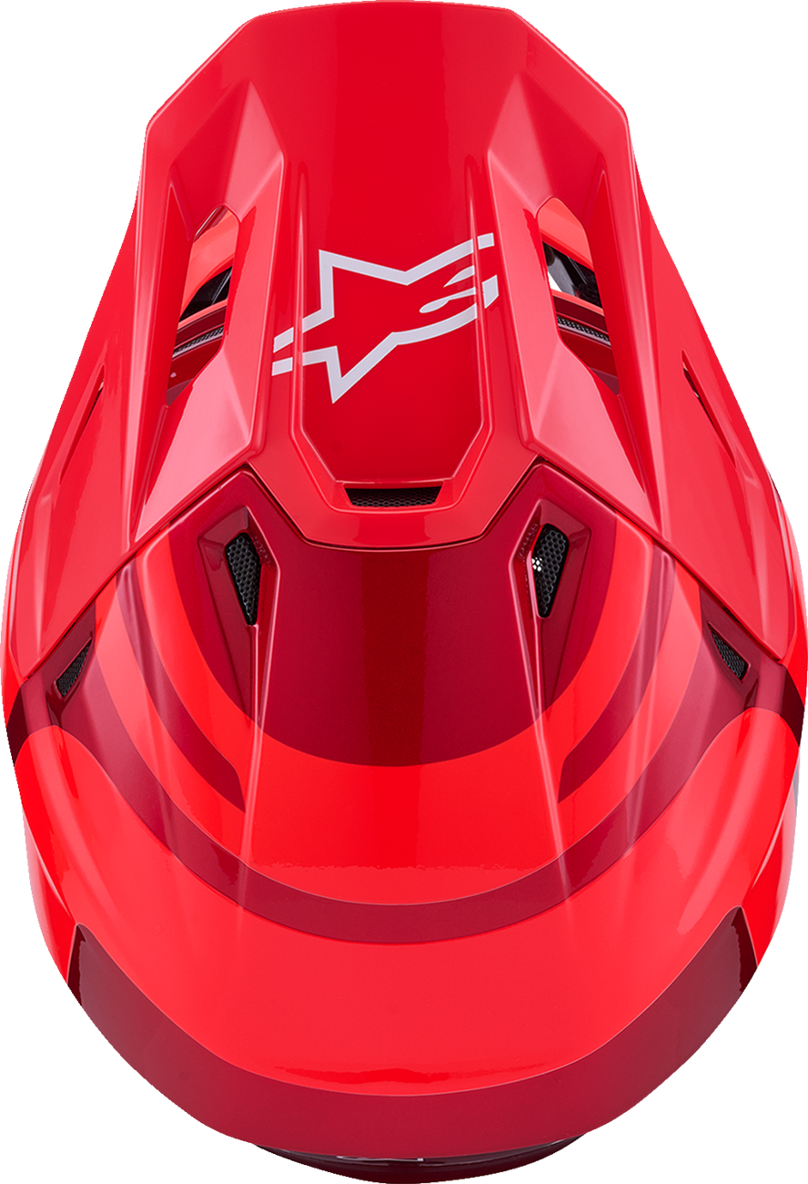 Alpinestars SM7 Core helmet in gloss red, small size, designed for off-road racing protection with a sturdy shell and secure fit.