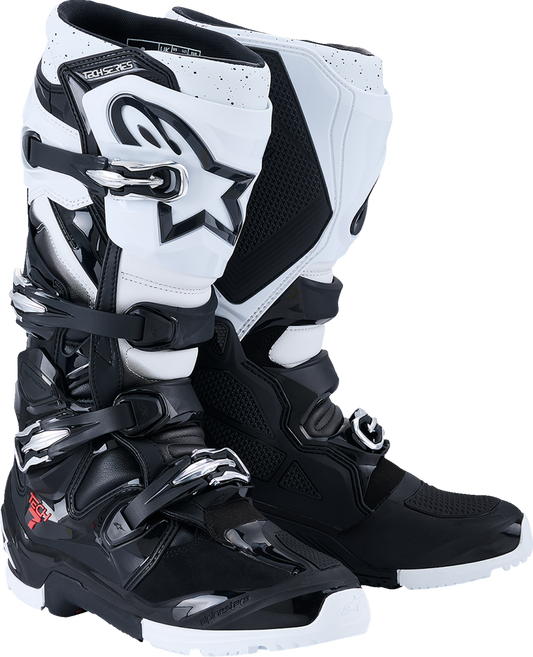 Alpinestars Tech 7 Enduro motorcycle boots in black and white, US size 7, with protective design and sturdy construction.