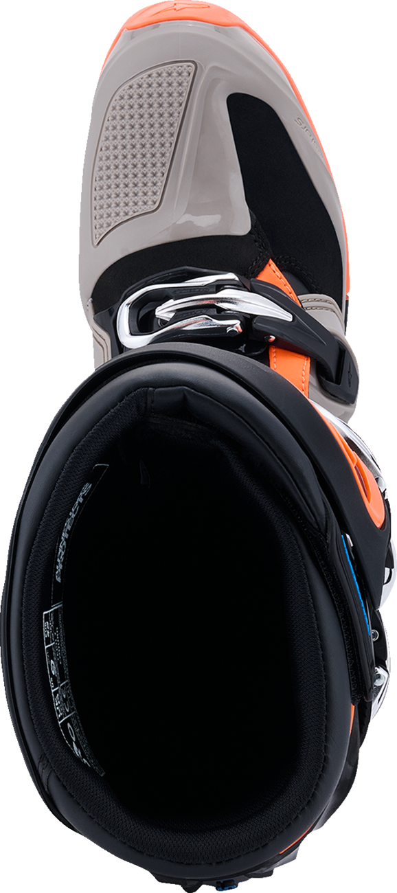 Alpinestars Tech 7 Enduro motorcycle boots in black, warm gray, and fluorescent orange with US size 8, showing rugged riding footwear.