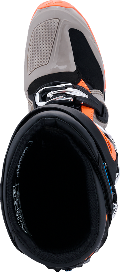 Alpinestars Tech 7 Enduro motorcycle boots in black, warm gray, and fluorescent orange with US size 8, showing rugged riding footwear.