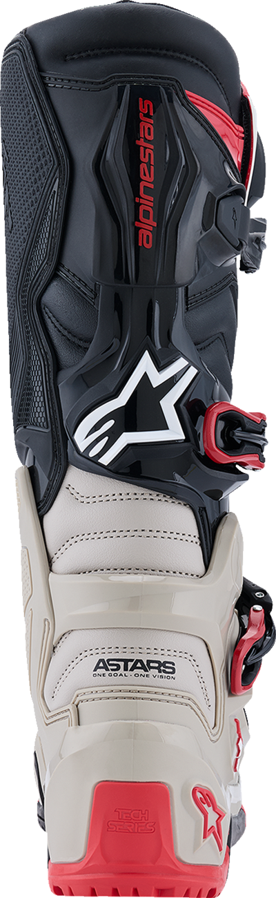 Alpinestars Tech 7 Enduro motorcycle boots in black, light gray, and bright red with sturdy design and ankle protection.