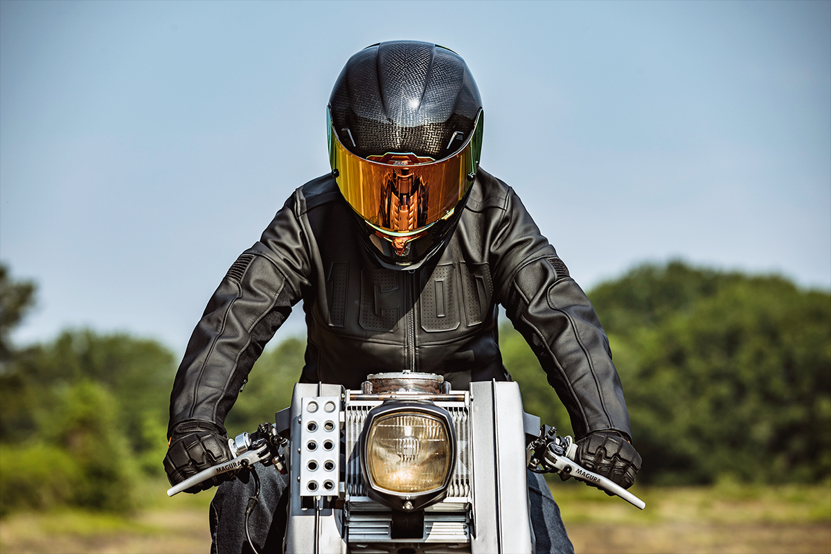 ICON Airframe Pro™ helmet in carbon fiber with red finish, small size, showcasing a sleek motorcycle helmet design.