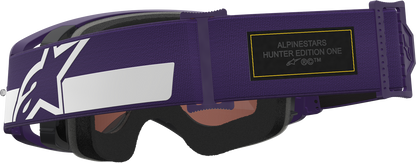 Alpinestars Gogglessupertech Hunta 96 XXV goggles in purple and white with silver mirror lens, showcasing sporty design and adjustable strap.