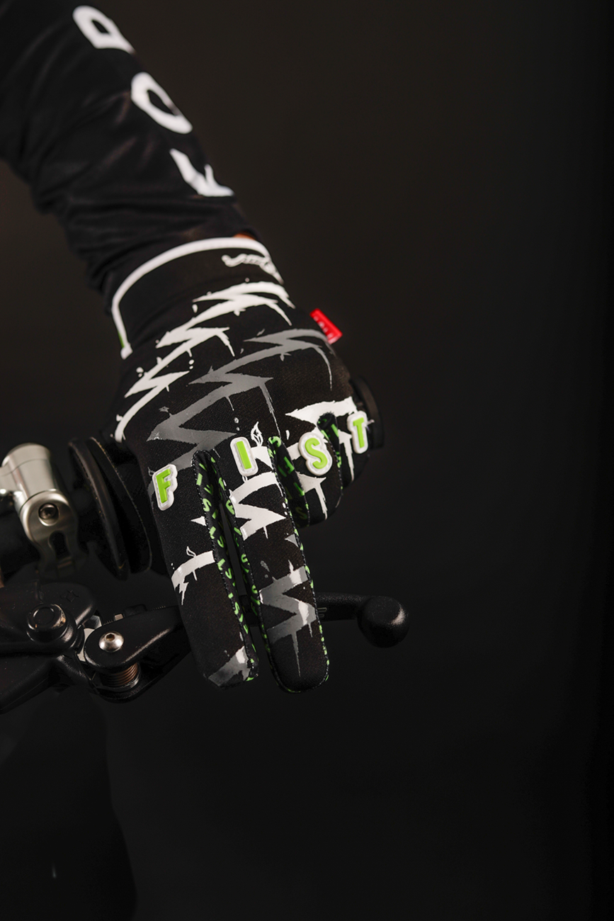 FIST Handwear strapped Taka Higashino Cali Roll gloves in 2XS, black with adjustable strap and logo details.