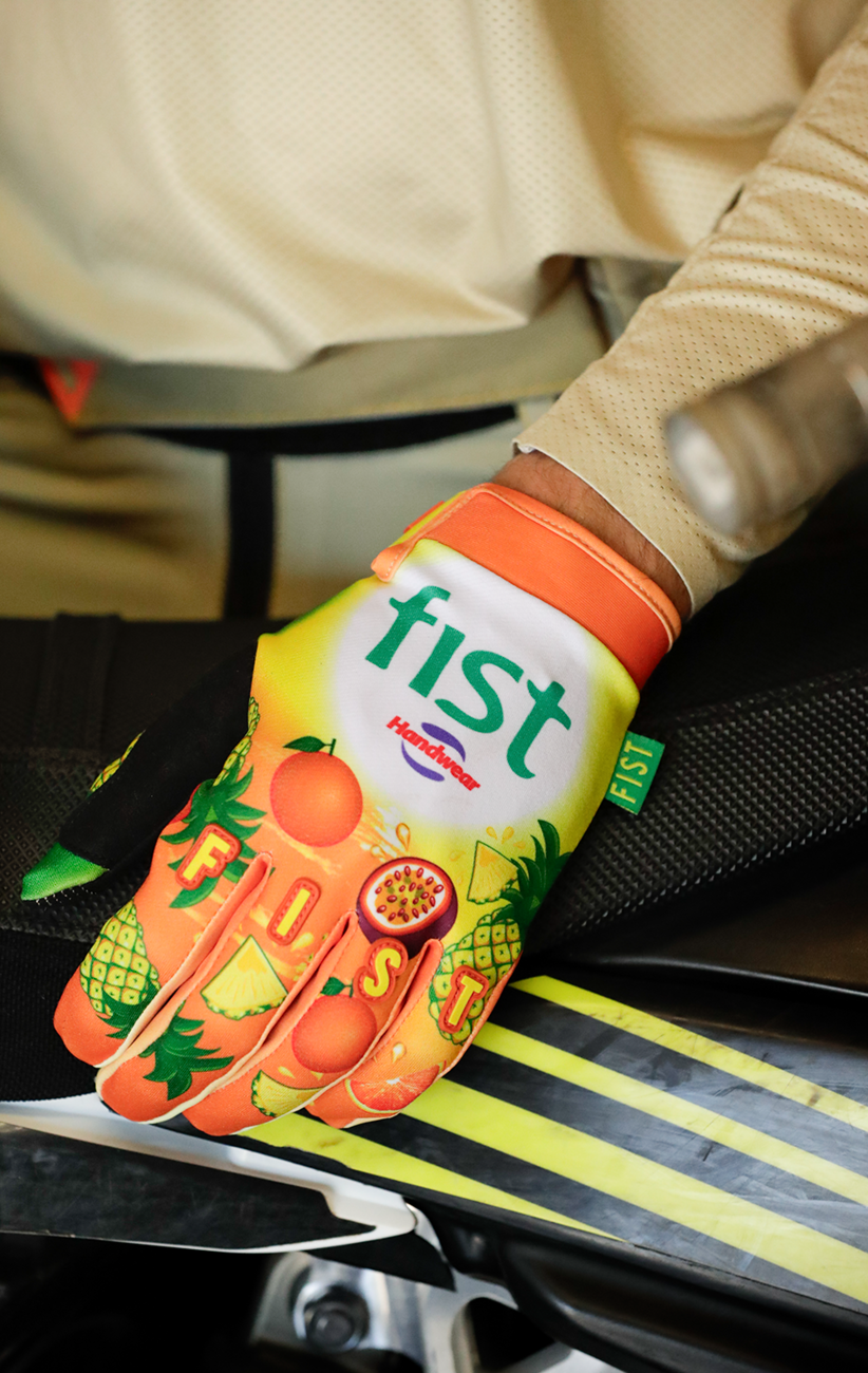 FIST Handwear strapped Fruit Punch gloves in medium size with grip-enhancing straps and comfortable fit, shown in image 5586481.
