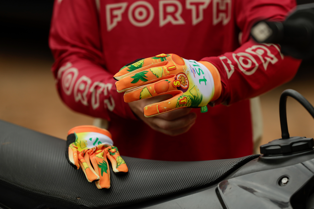 FIST Handwear Fruit Punch Gloves Medium with straps, designed for superior grip and comfort during sports or workouts.