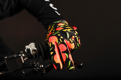 Red FIST Handwear R-Willy Mango Madness gloves in XS size, featuring the branded strap and vibrant color design.