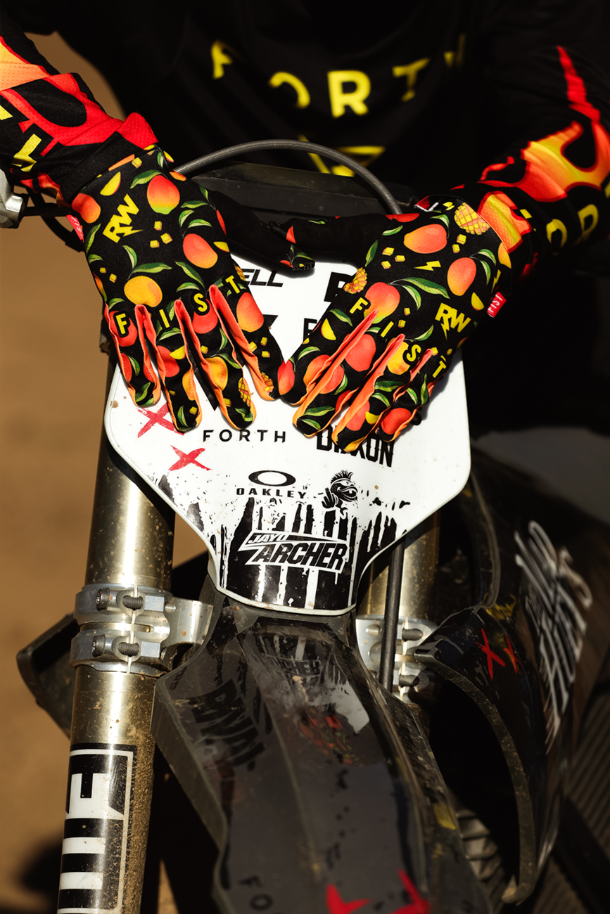 FIST Handwear Mango Madness R-Willy Red Label gloves in red, size XS, with black straps and textured design for grip.