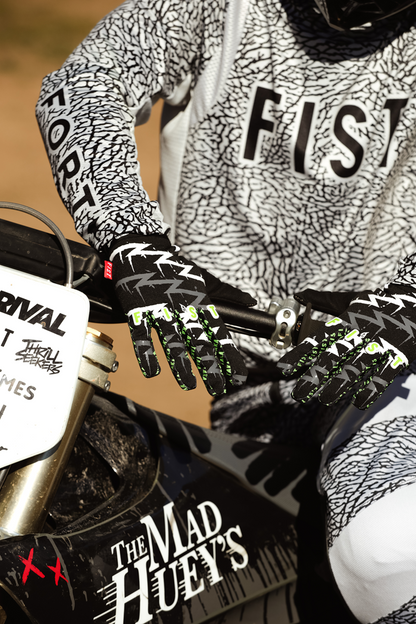 FIST Handwear Taka Higashino Cali Roll gloves in XS with black straps and colorful design, showing the textured fabric and branding.