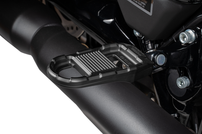 Black DRAG SPECIALTIES adjustable motorcycle foot pegs with mounting hardware for enhanced rider comfort and control.