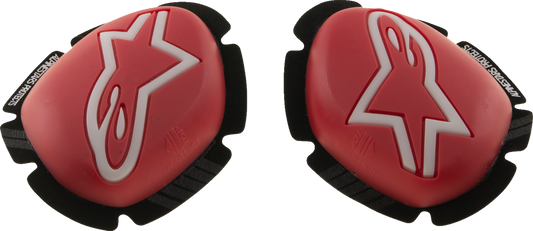 Alpinestars GP Plus knee sliders in red and white, designed for motorcycle racing protection and performance.