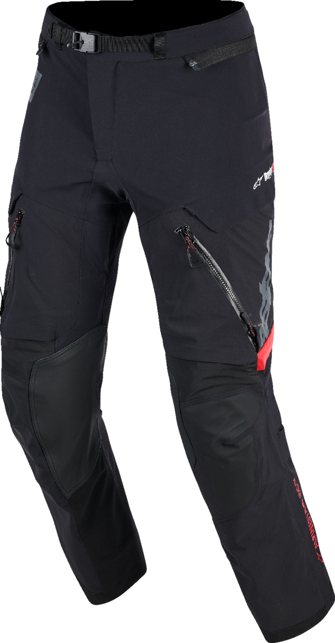 Alpinestars Halo Pro Drystar XF rain pants in black and dark shadow, waterproof motorcycle gear, medium size, shown on hanger.