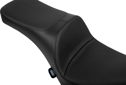 Drag Specialties Freedom Seat for FL/FX motorcycles, black and contoured for comfort, with sleek design and mounting hardware.