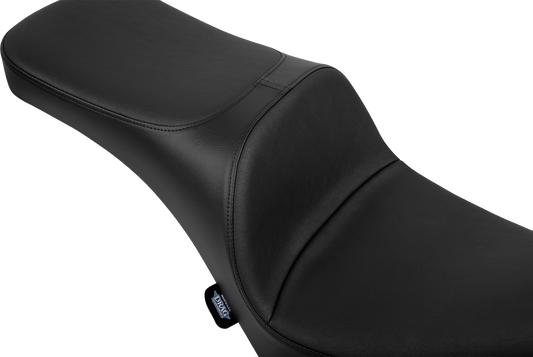 Drag Specialties Freedom Seat for FL/FX motorcycles, black and contoured for comfort, with sleek design and mounting hardware.