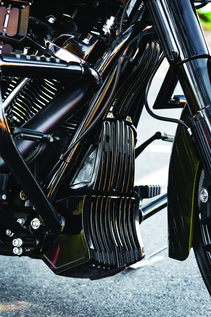 Kuryakyn black oil cooler cover for Harley Davidson Touring models, part #6418, showcasing a sleek protective accessory.