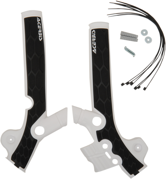 A close-up of white and black Acerbis X-Grip frame guards for Yamaha SX 85 motorcycle, showcasing durable body protection.