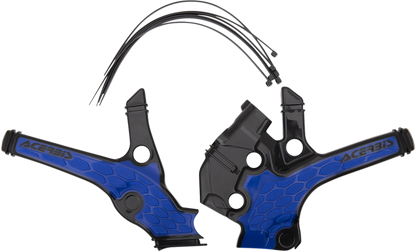 A set of Acerbis X-Grip black and blue motorcycle frame guards installed on a bike's body, showing detailed close-up of the protective covers.