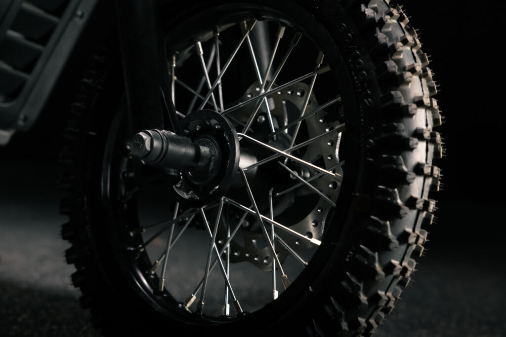 Greenger G2 electric dirt bike for kids, 50cc equivalent, with black and red frame and off-road tires.
