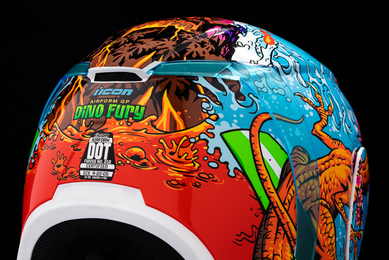 Bill's Exhausts ICON Airform Dino Fury helmet in medium size, featuring a colorful dinosaur design and aerodynamic helmet shape.