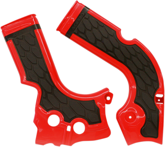 A set of ACERBIS X-Grip motorcycle frame guards in red and black, designed to protect the bike’s body and frame.