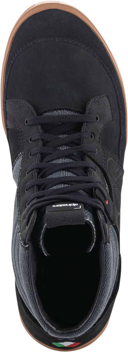 Black Alpinestars Grange shoes in US 10.5 with sleek design and textured sole, displayed on a plain background.
