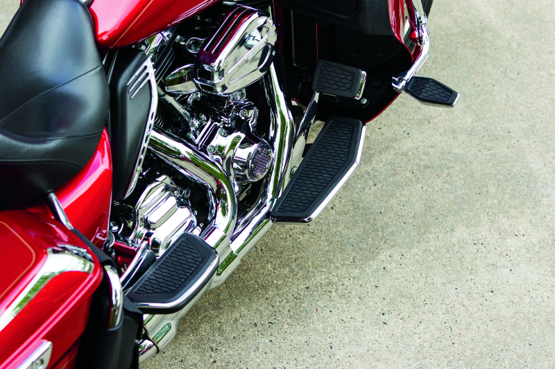 Chrome Kuryakyn Hex Pegs with adapters for powersports vehicles, showing the textured footrests and mounting hardware.