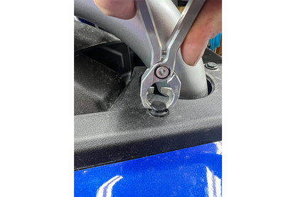 MOTION PRO Pinklaw body work plastic rivet removal tool, Part #08-0766, shown in use on vehicle panel.