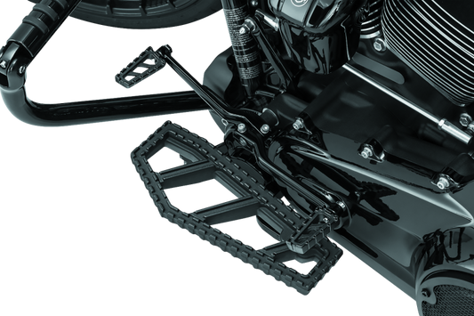 Kuryakyn Riot Floorboards for Harley Davidson in satin black with textured surface and mounting hardware.