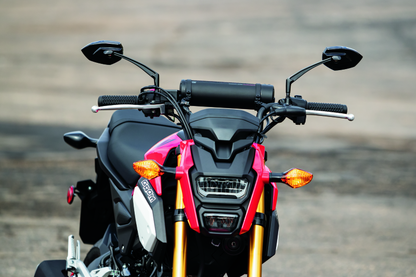 Kuryakyn Universal Mirror Adapters for Metric Cruiser Bikes, part #1891, shown attached to motorcycle handlebars.