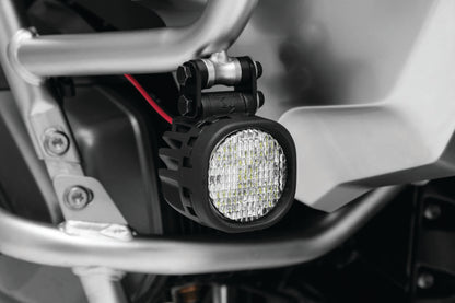 Kuryakyn Lodestar 750L flood beam high-output driving lights mounted on a powersports vehicle for enhanced visibility.