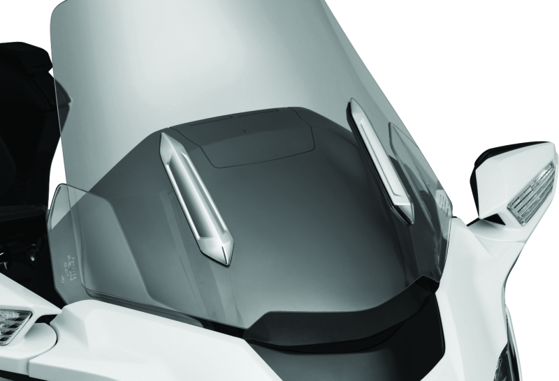 Kuryakyn Omni Windshield Trim in chrome for Honda GL1800 motorcycle, showing the shiny, curved trim piece installed on the windshield.