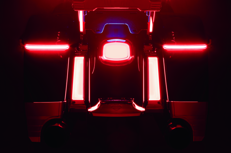 Kuryakyn Tracer LED taillight with red lens and license plate light installed on a Harley Davidson motorcycle