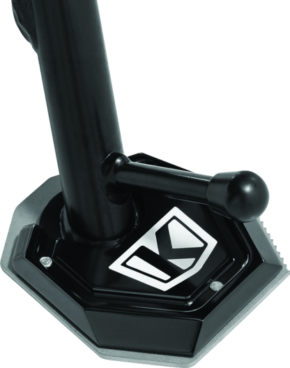 Black Kuryakyn Lodestar Kickstand Shoe for BMW F750GS adds stability and traction to motorcycle side stand.