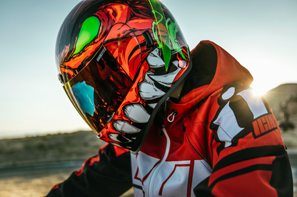 Red ICON Airform™ helmet for men, medium size, featuring a sleek design and adjustable straps.