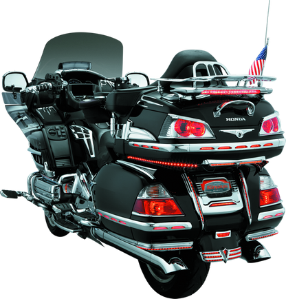 Chrome Kuryakyn trunk keyhole trim for Honda Gold Wing 2001-2017, showcasing a sleek, polished accessory on the motorcycle trunk.