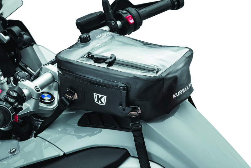 Kuryakyn Torke 7L dry tank bag with backpack straps, waterproof design, mounted on motorcycle fuel tank.