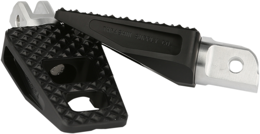 Black THRASHIN SUPPLY CO. Front P-54 Foot Pegs for Softail motorcycle, showcasing durable metal design and installation details.