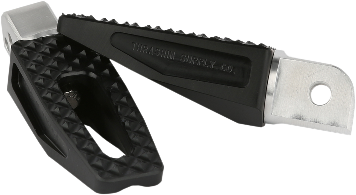Black THRASHIN SUPPLY CO. Rear P-54 Slim Foot Pegs mounted on motorcycle, showcasing durable metal construction and sleek design.
