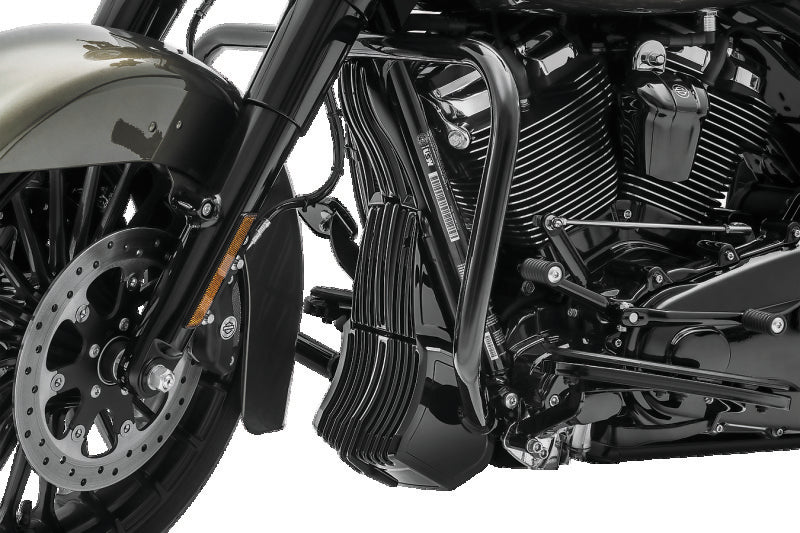 Kuryakyn Precision Regulator Cover in black for Harley Davidson Touring models, shown on motorcycle engine component.
