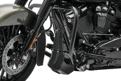Kuryakyn Precision Regulator Cover in black for Harley Davidson Touring models, shown on motorcycle engine component.