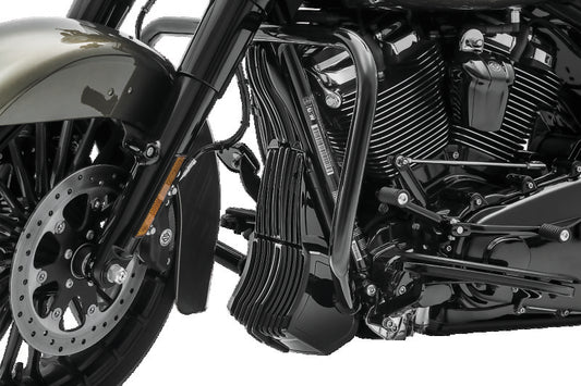 Kuryakyn Precision Regulator Cover in black for Harley Davidson Touring models, shown on motorcycle engine component.